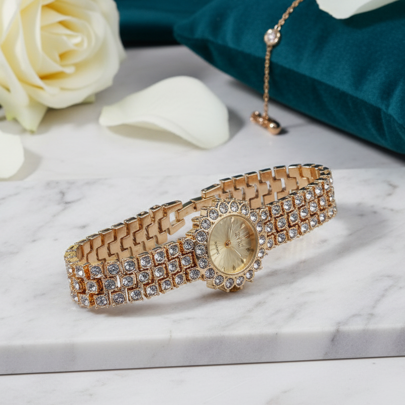 Gold bracelet with gemstones on a marble surface with white roses and a green fabric background