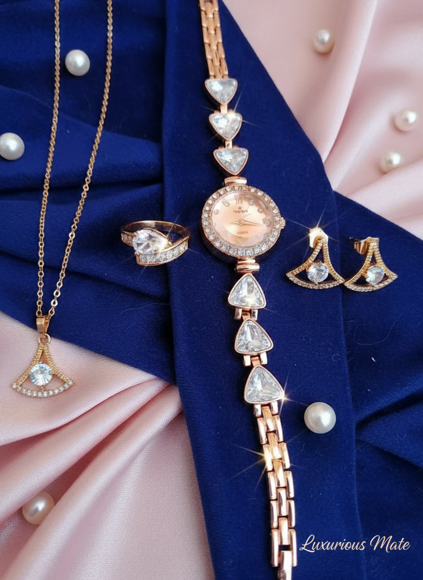 Jewelry set including necklace, ring, and earrings on a blue and pink fabric background