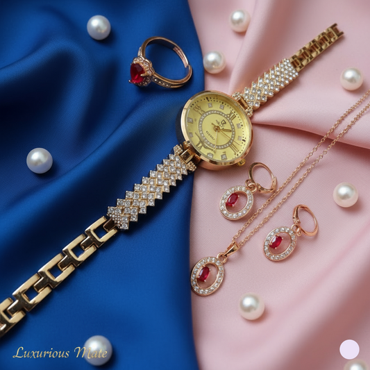 Gold watch, ring, and earrings on a blue and pink fabric background with pearls.